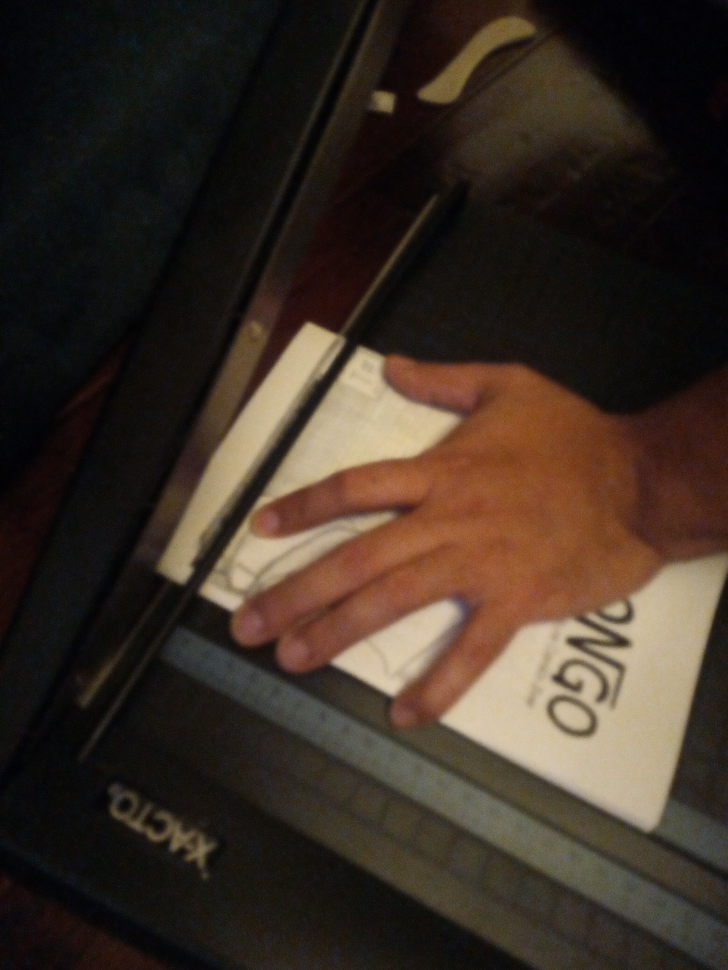 Cutting edges of the zine with X-acto Guillotine.